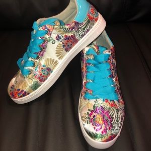 New size 10 white Embroidered tennis shoe.